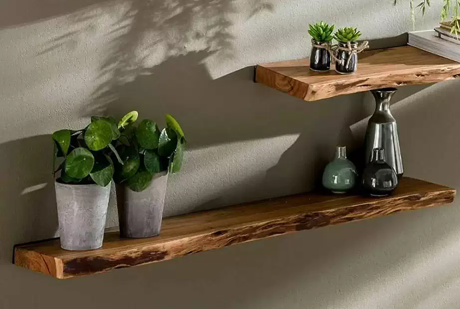 Picture of two rows of wooden shelves installed on the wall with vase and bottles on it