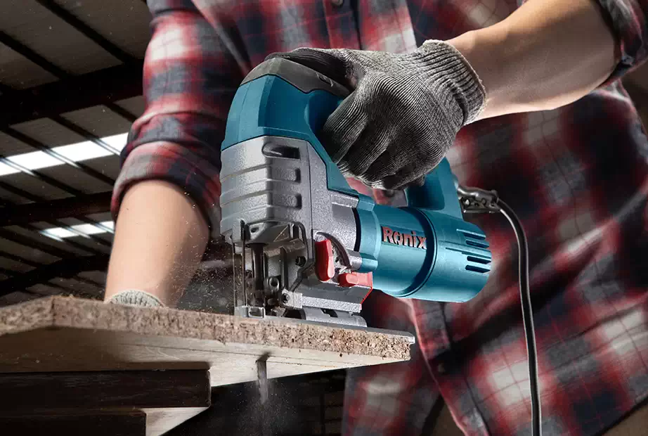 A man using a Ronix jigsaw on wood