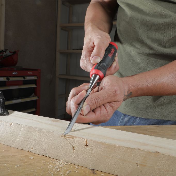 picture of a person using a chisel 