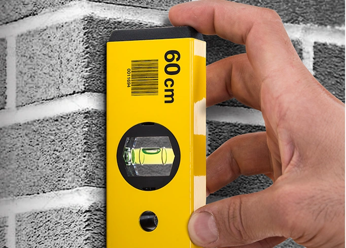 A spirit level is being used