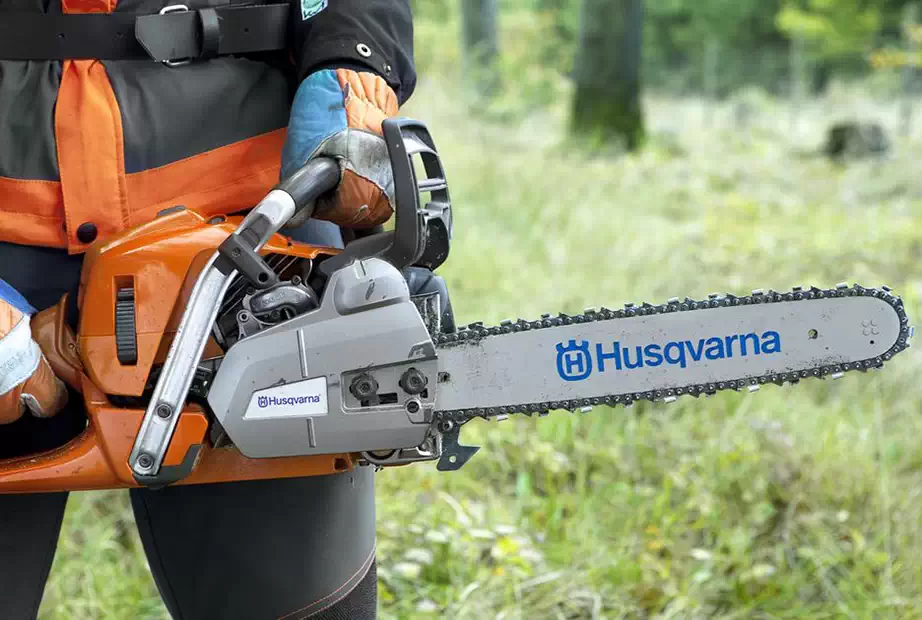 Using a chainsaw to cut weed