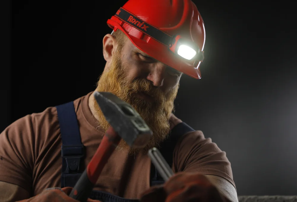 Photo of someone using the best headlamp for working.