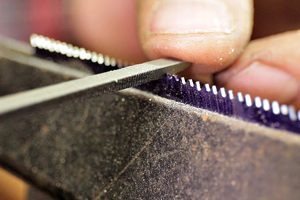 Handsaw Blades being sharpened