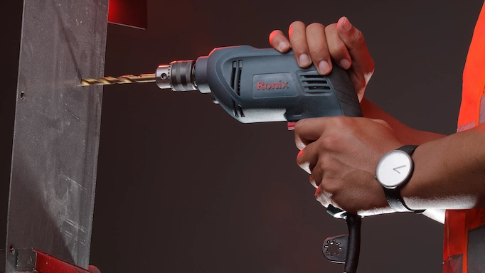  A corded drill being used