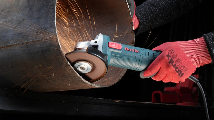 Angle grinder is used to grind the interior section of a pipe