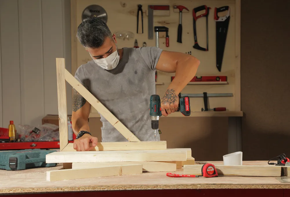 a cordless drill being used to make a chair