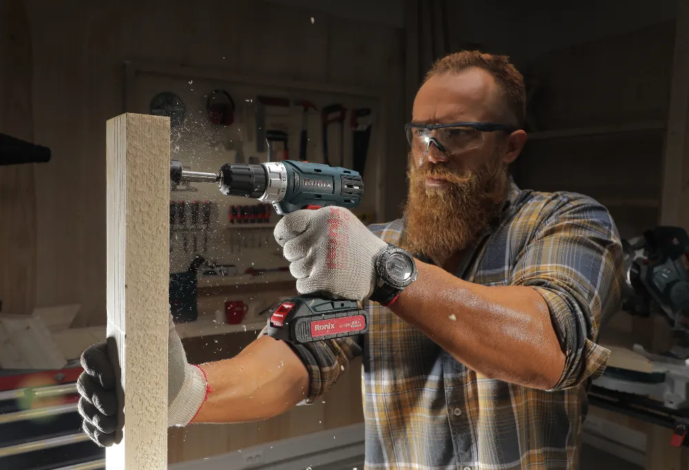 The Ronix cordless drill being used to drill a hole