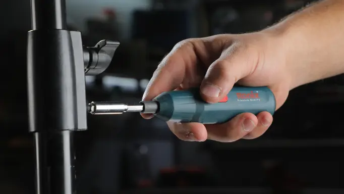Tightening screws on a camera tripod Using a Ronix Cordless Screwdriver  