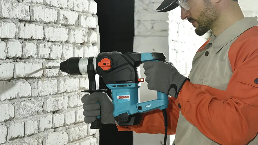 picture of a person using an Eneacro corded rotary hammer drill