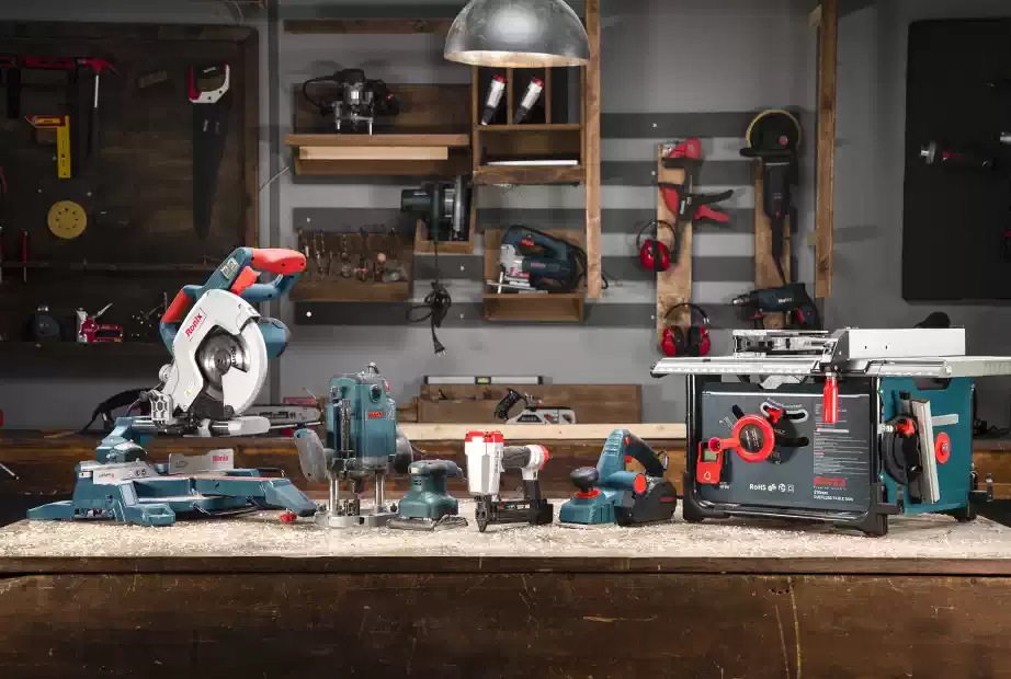 A collection of various hand and power tools in a carpentry workshop