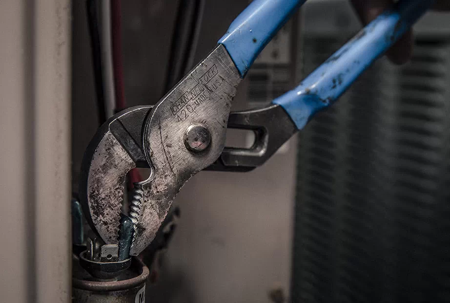 Channellock adjustable plier being used on a pipe