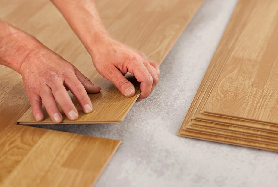  A man installing laminate flooring