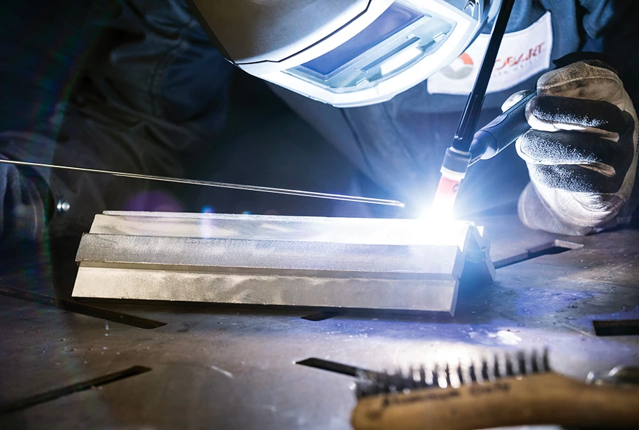  A man welding aluminum with a TIG welder