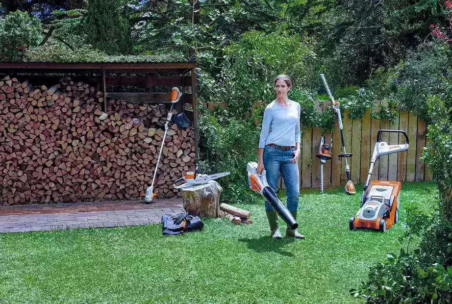  A woman doing garden works with Stihl gardening tools