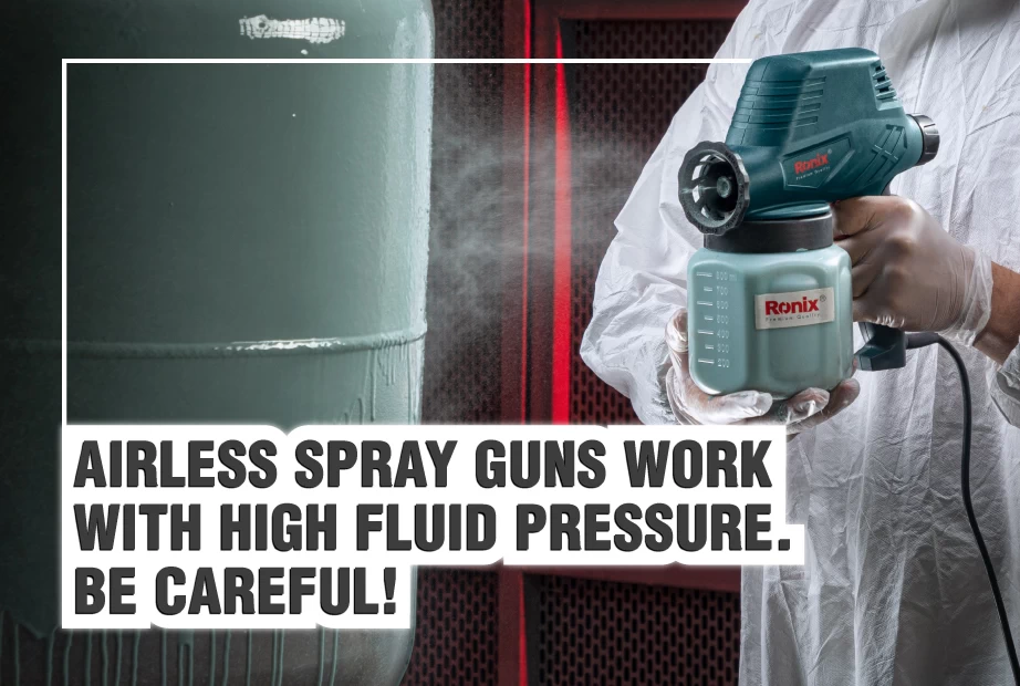 An airless spray gun used to paint a surface