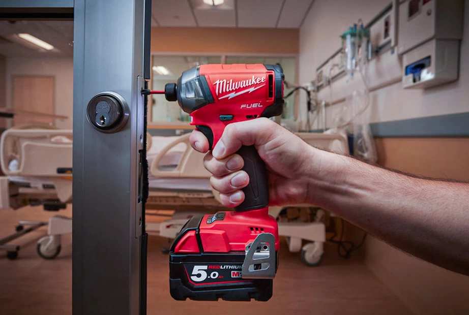 Milwaukee impact driver is being used to turn a fastener