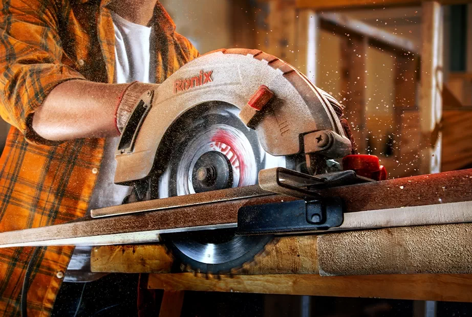 Using a Ronix corded circular saw to cut wood