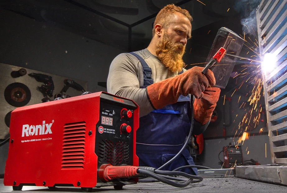 a man working with Stick Welding Machine