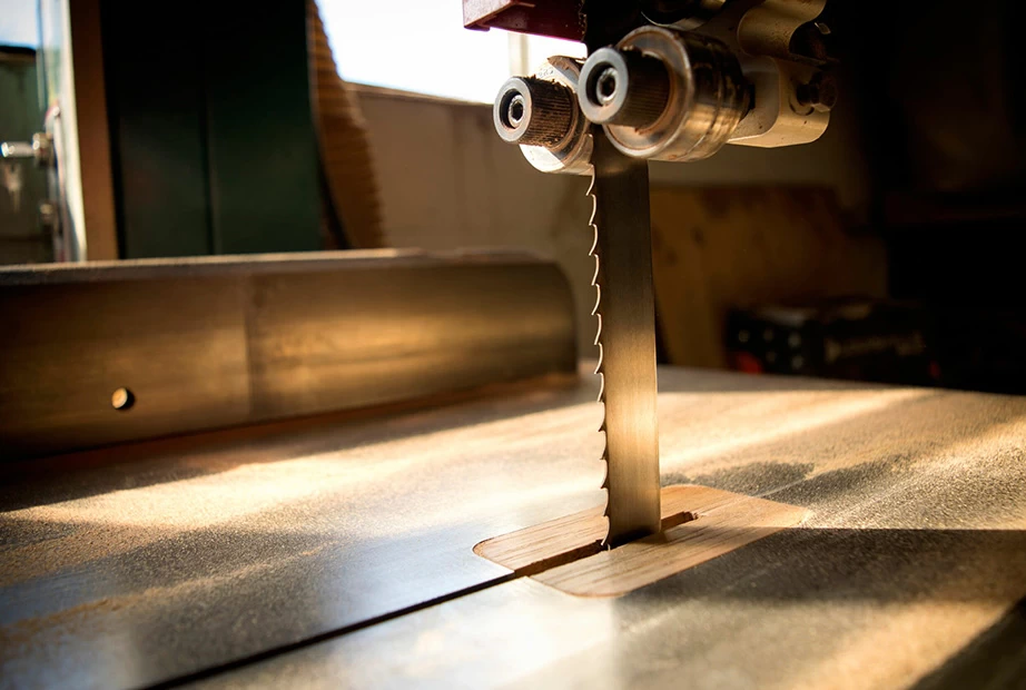  A picture of a band saw cutting through wood