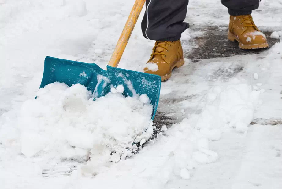 A shovel being used to clear snow