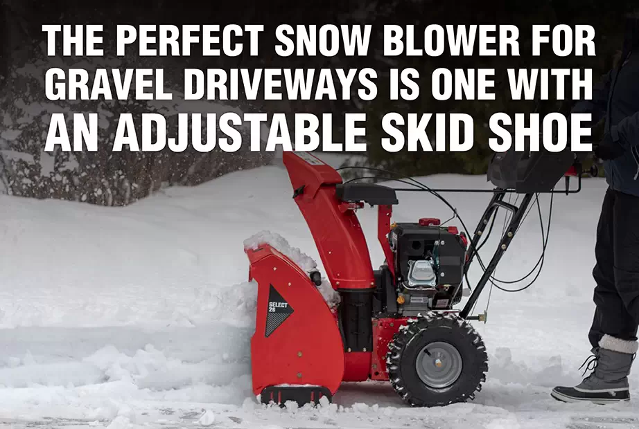 A snow blower used to clear a gravel driveway with an adjustable skid shoe