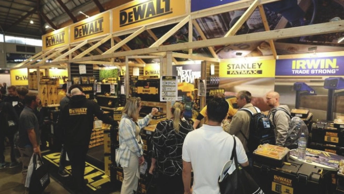 Attendees of a trade show visiting DeWalt’s booth