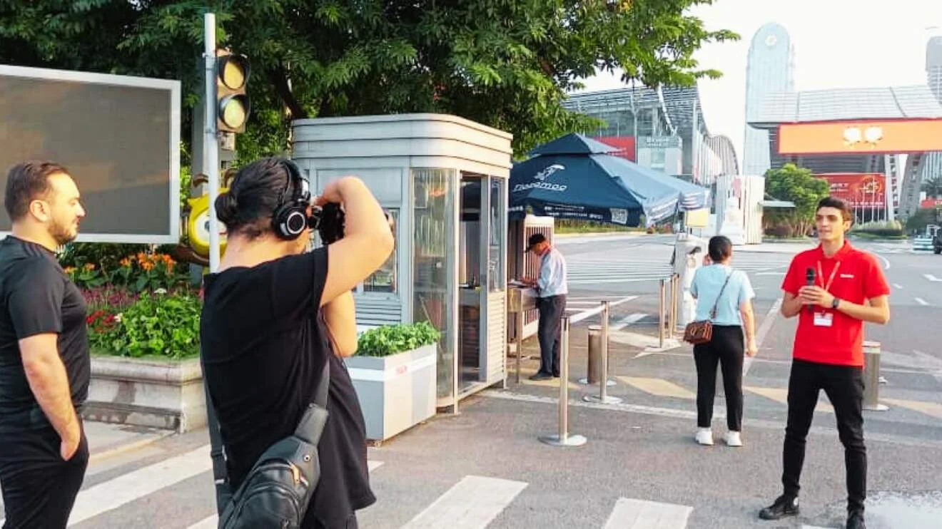 A cameraman and host recording a video at Canton Fair 2023