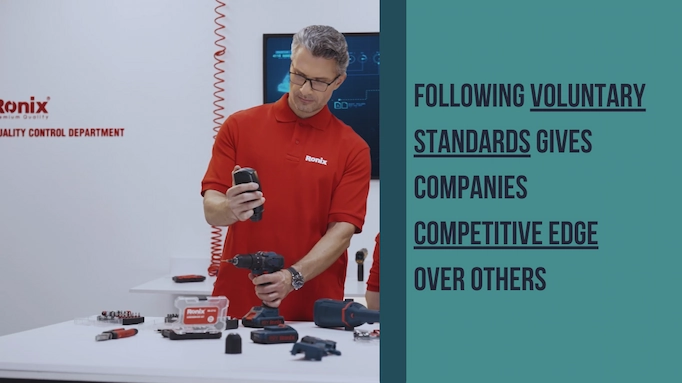 A cordless drill is being quality controlled plus info about benefits of standards