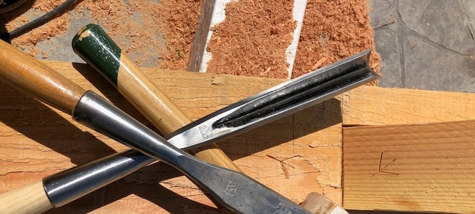 A corner chisel among other types of chisels