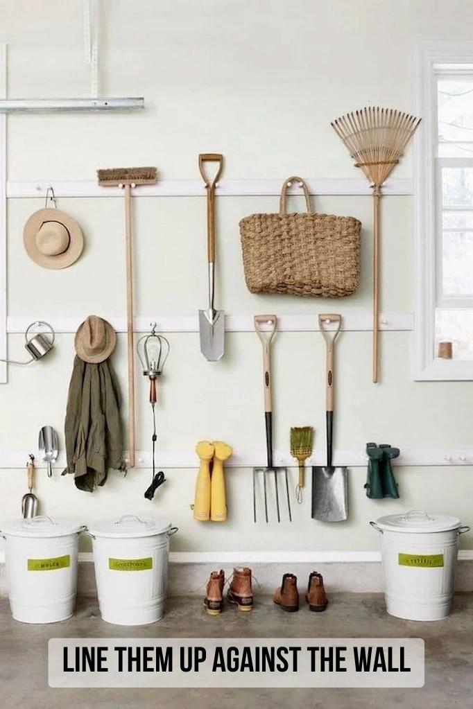  lining garden tools against the wall