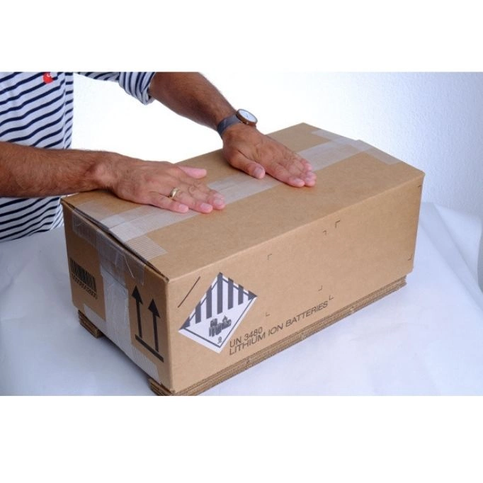 picture of a man wrapping a box
