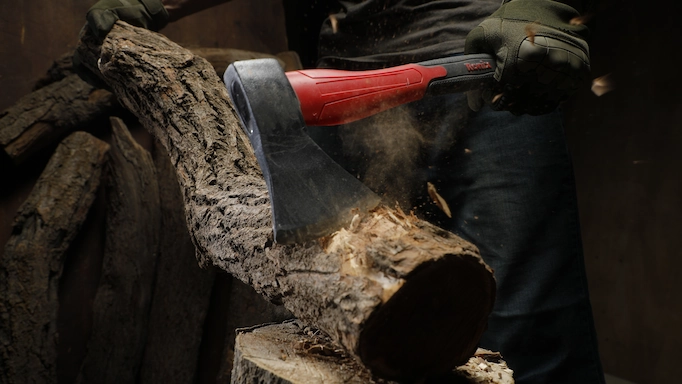 An axe is being used on a tree