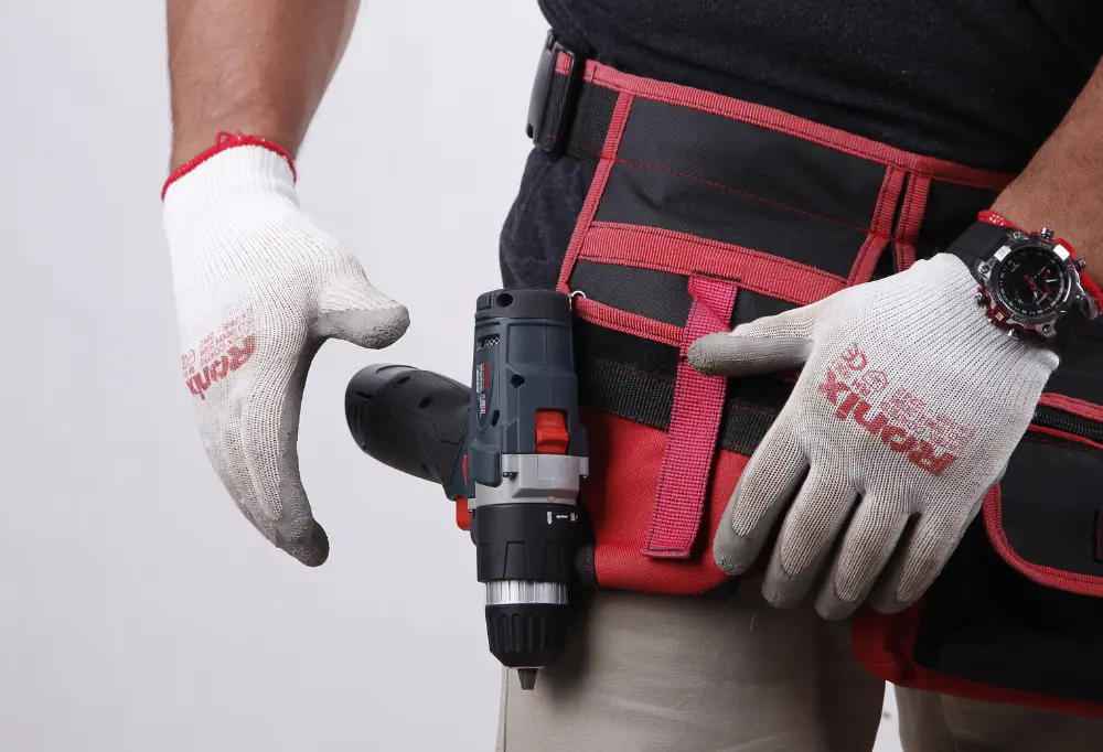 A Drill Driver strapped to a man’s tool belt