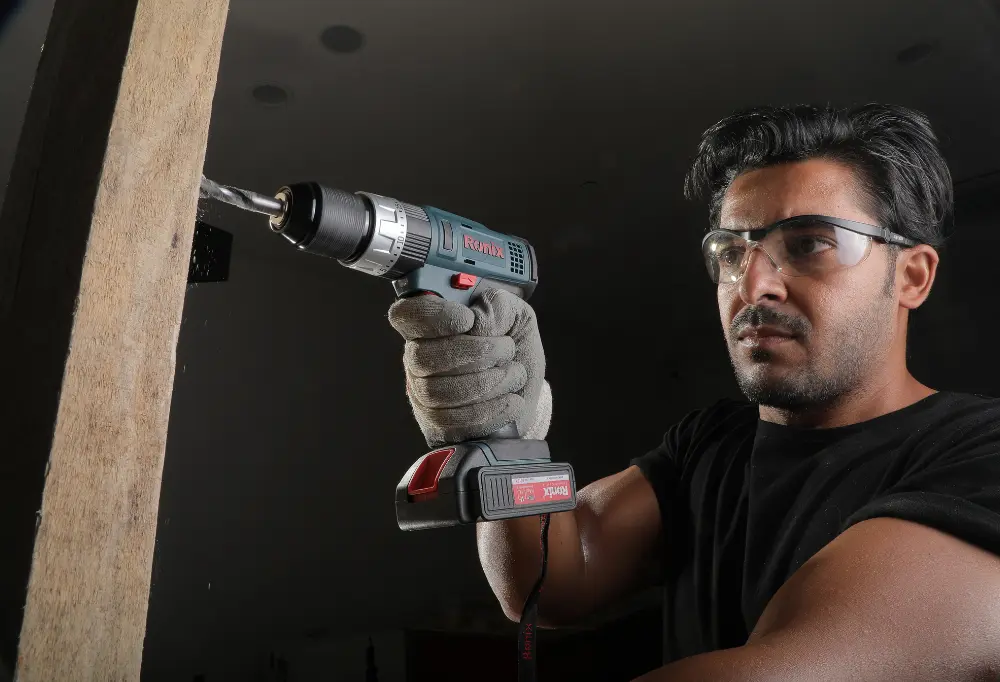Ronix Drill Driver being used on a wall frame