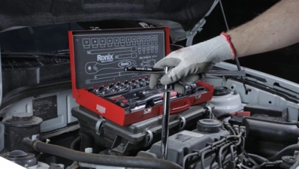 A picture of socket set being used on a car