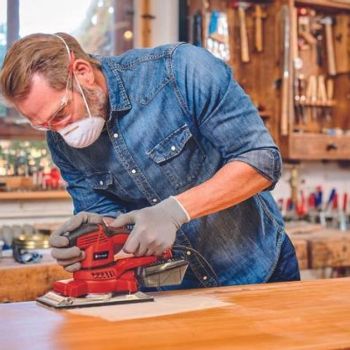 picture of a person working with a sander