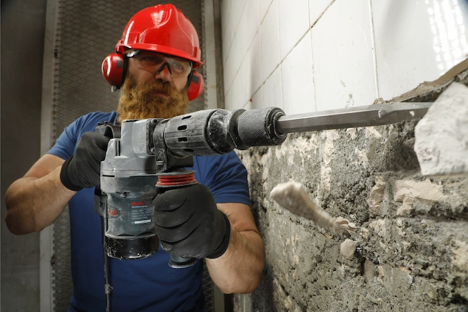 Demolition hammer is used to remove tiles