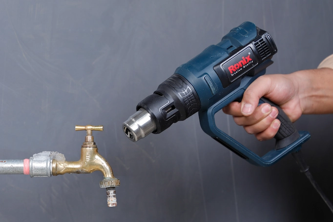 Heat gun used for thawing a frozen pipe