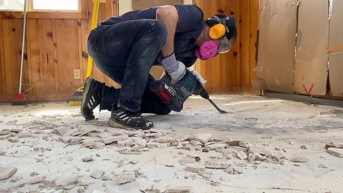 Rotary hammer is used to remove floor tiles