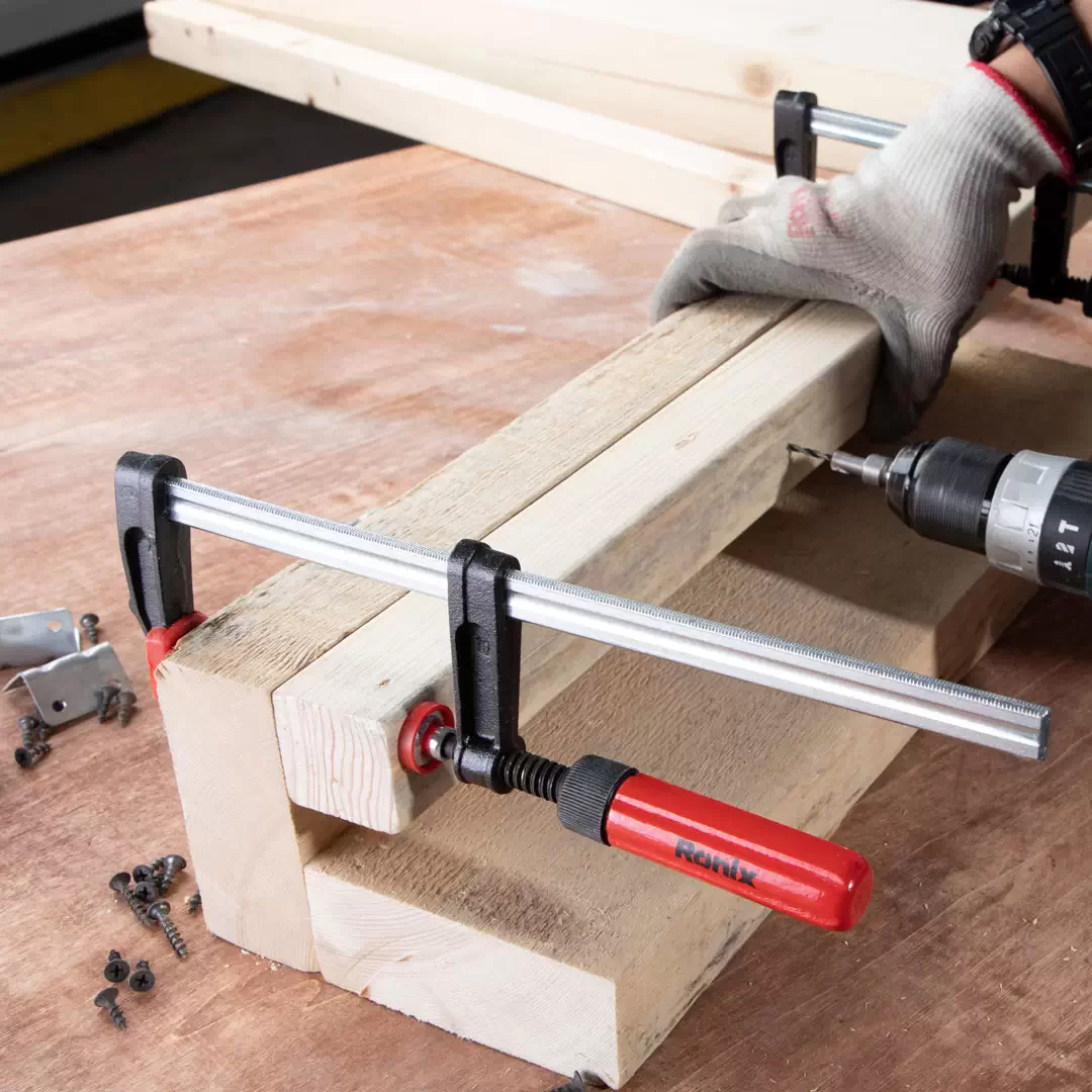 picture of a person using ronix clamps for woodworking 