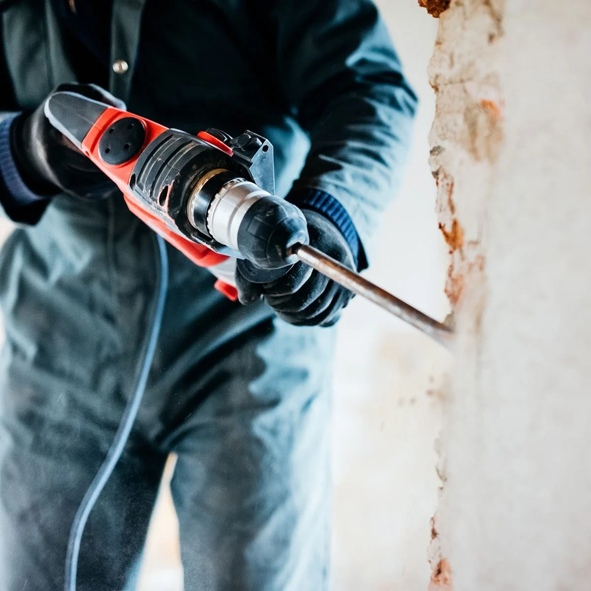 a man working with a rotary hammer