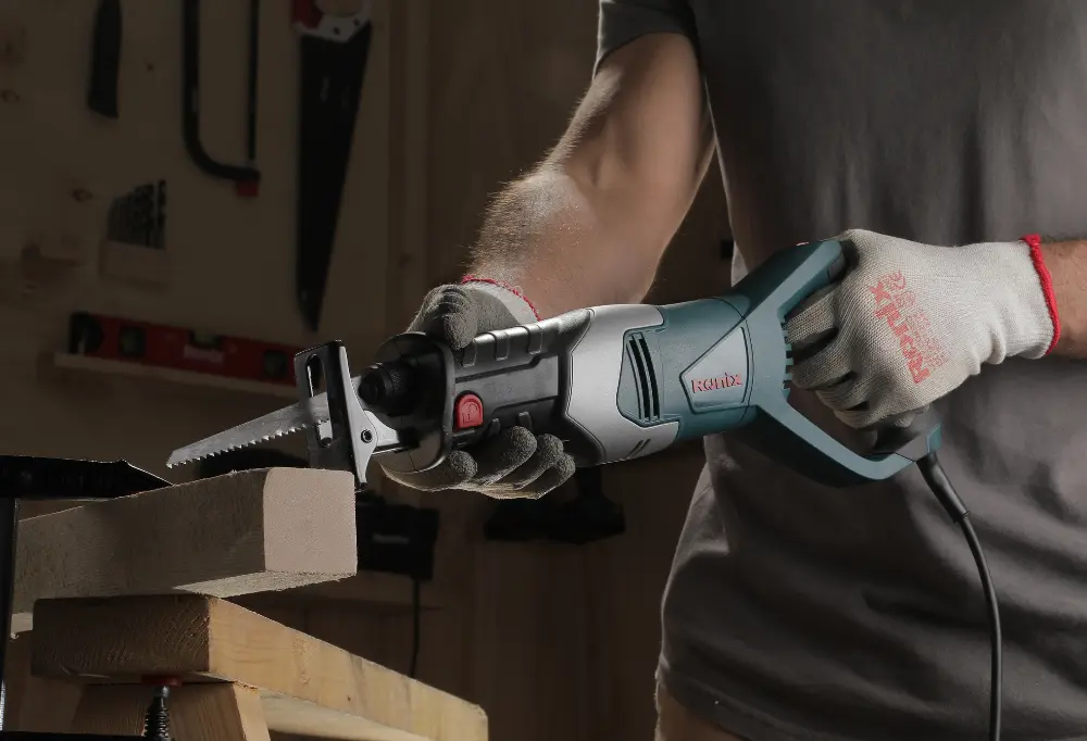 Using a Ronix reciprocating saw on a piece of wood