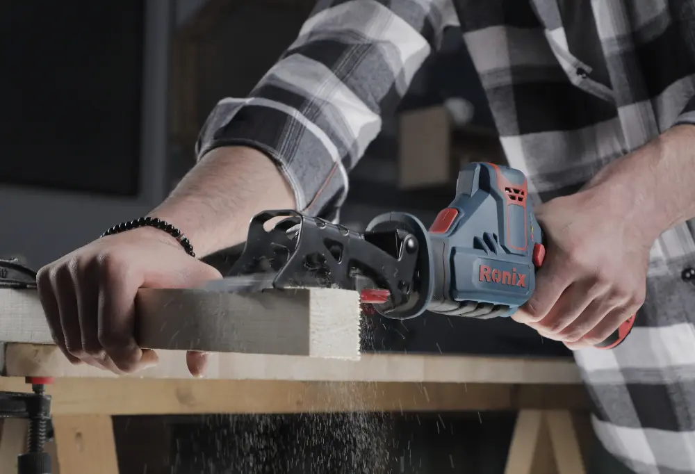 Using a Ronix reciprocating saw on a piece of wood