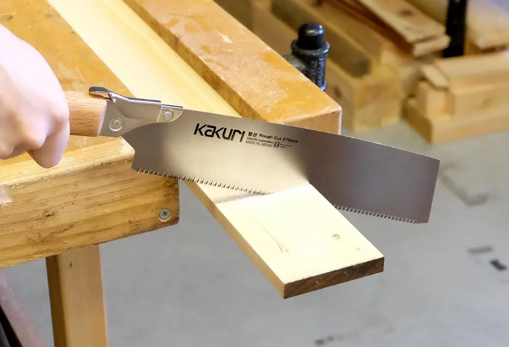 a Japanese-style being used to cut plywood