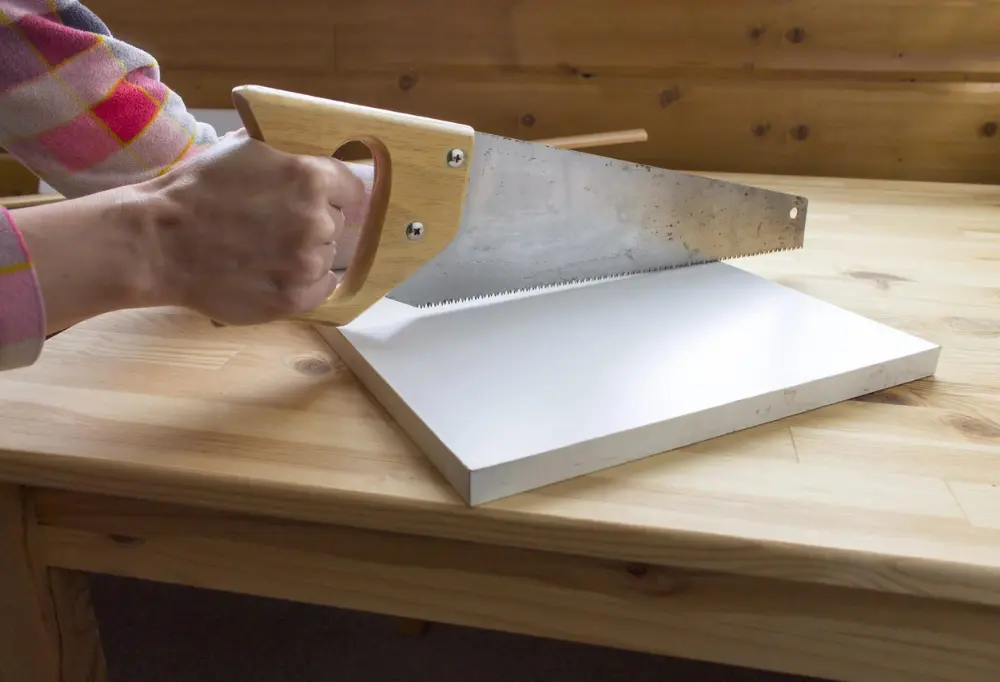 using a hand saw for cutting