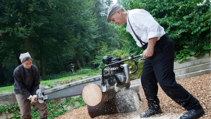 A two-man chainsaw in use