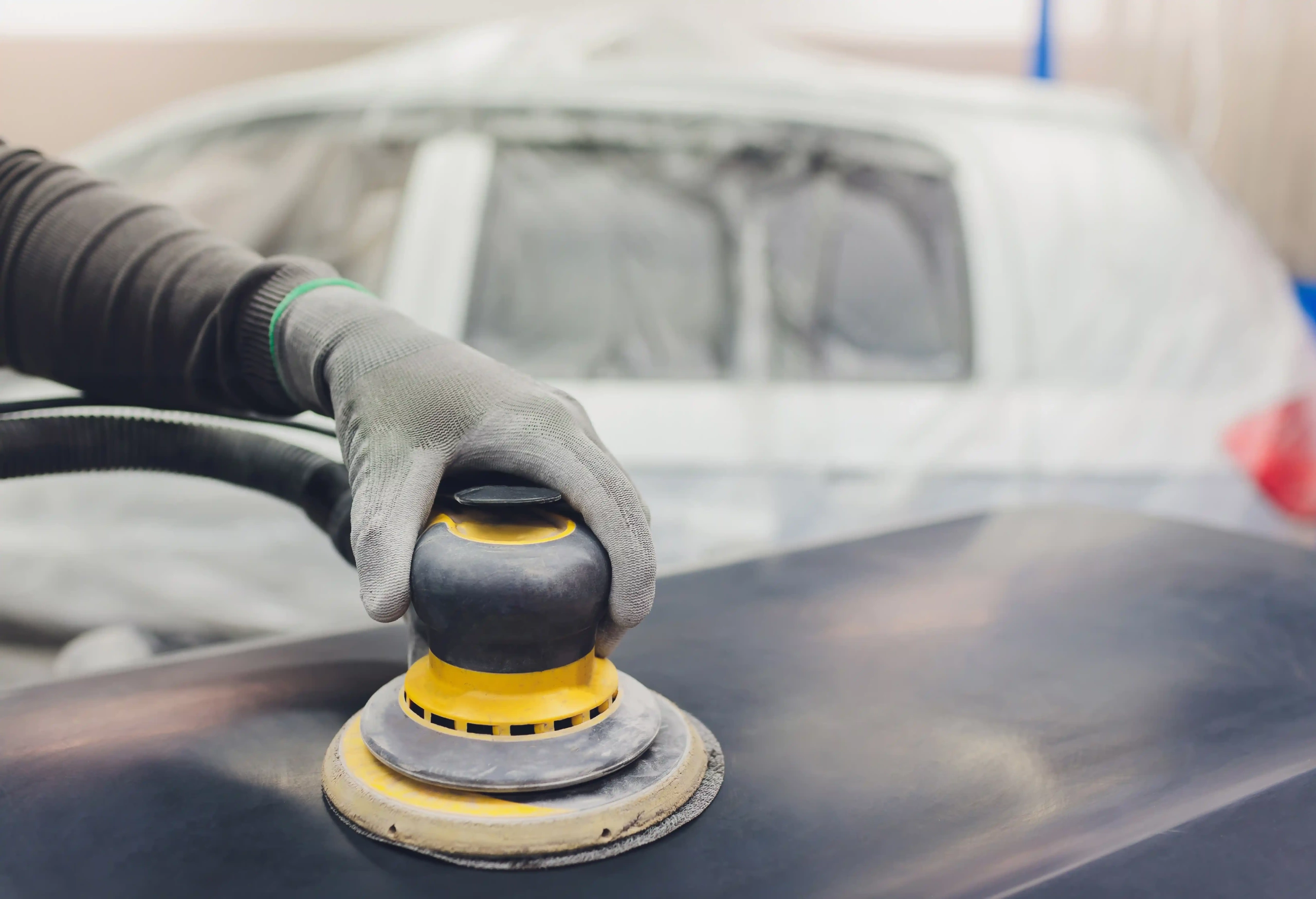 A Pneumatic car buffer working on a car