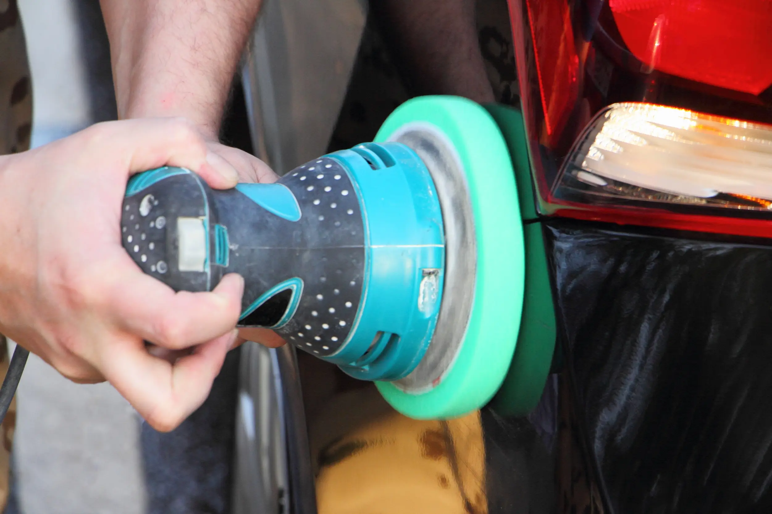 A Car Buffer being used on a car