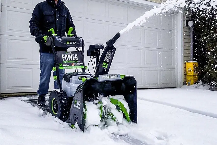 An air snow blower cleaning snow off the floor