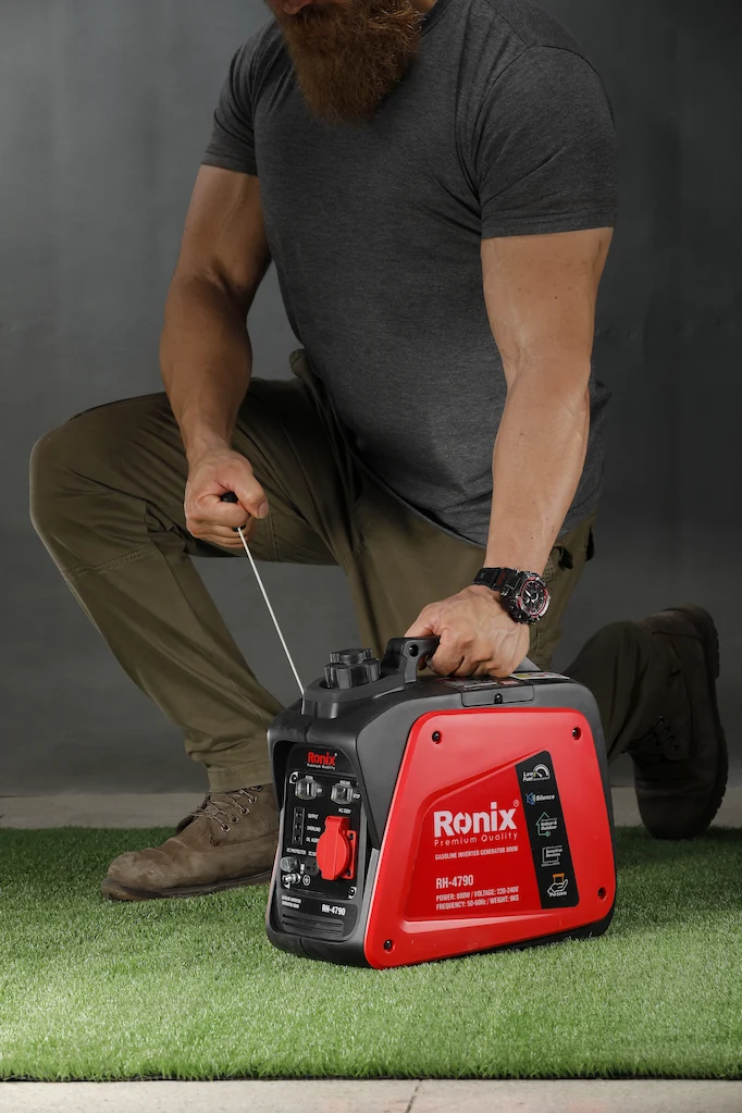 Man starting a portable generator